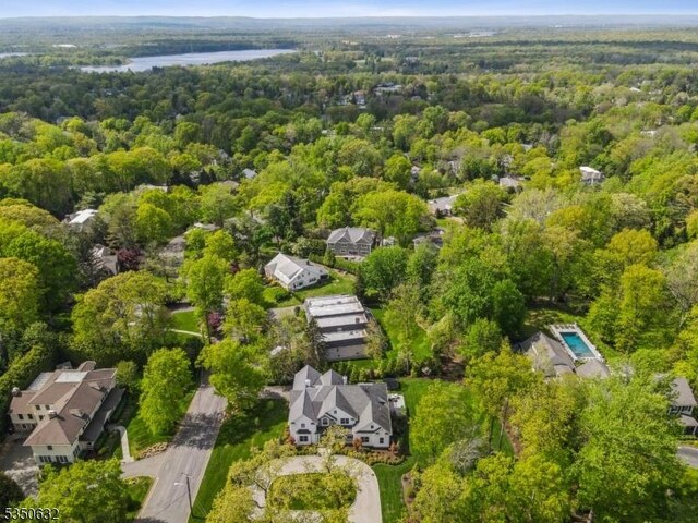 260 Hartshorn Dr, Millburn Twp, NJ 07078 - drone / aerial view of a heavily wooded area and a large body of water