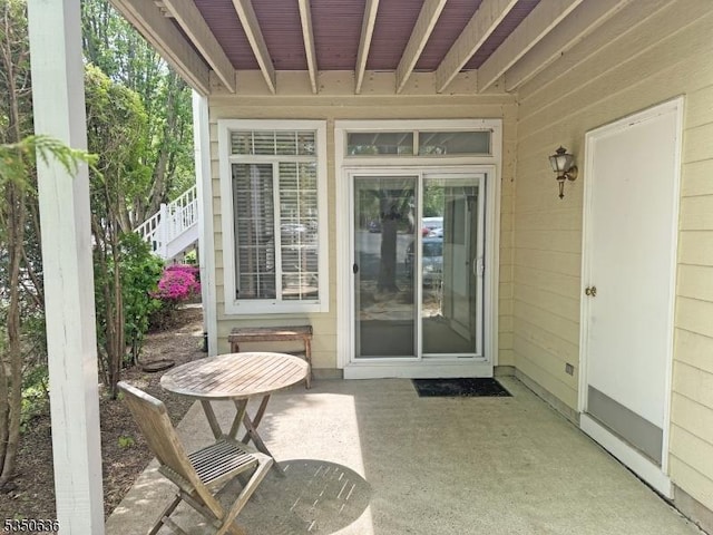 doorway to property with a patio