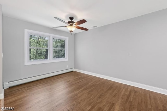 empty room with ceiling fan, visible vents, wood finished floors, baseboards, and a baseboard radiator