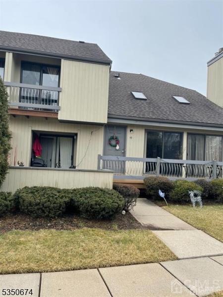 10 Brook St, Franklin Twp, NJ 08873 - view of front of house featuring a porch, a balcony, and roof with shingles