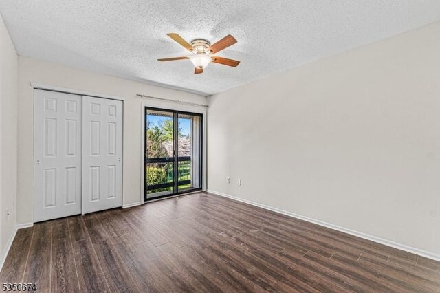 10 Brook St, Franklin Twp, NJ 08873 - unfurnished bedroom featuring wood finished floors, a textured ceiling, baseboards, and access to outside