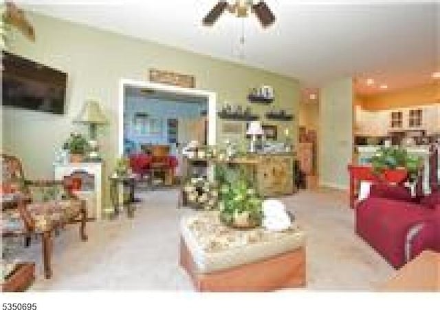 living room featuring a ceiling fan