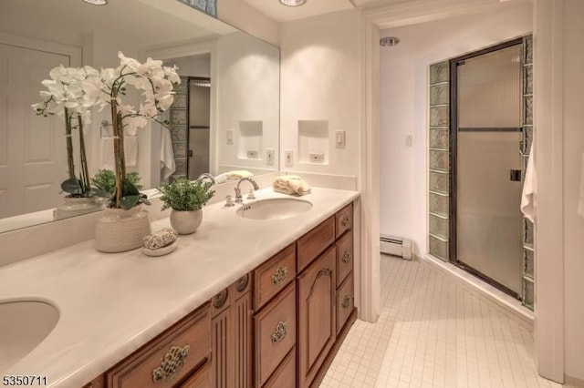 full bath featuring a baseboard heating unit, double vanity, tile patterned floors, and a stall shower