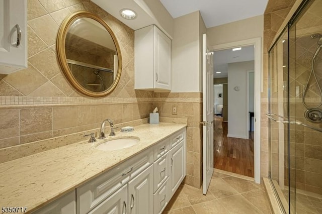 35 Clearview Dr, Randolph Twp, NJ 07869 - full bathroom with vanity, tile walls, a shower stall, and tile patterned flooring