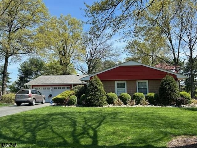27 Landry Rd, Franklin Twp, NJ 08873 - view of front of home featuring a garage, a front lawn, and concrete driveway
