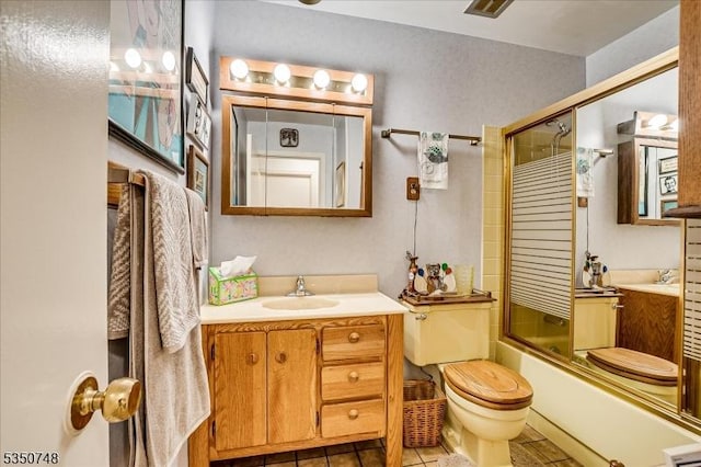 27 Landry Rd, Franklin Twp, NJ 08873 - bathroom featuring vanity, bath / shower combo with glass door, tile patterned flooring, and toilet