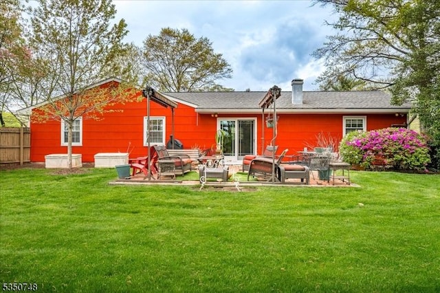 27 Landry Rd, Franklin Twp, NJ 08873 - back of house with a lawn, a patio area, fence, and a chimney