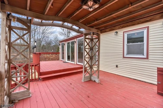 wooden deck with a ceiling fan