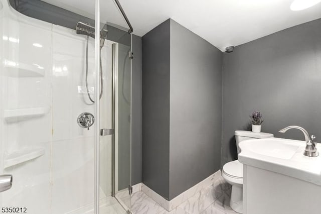 full bath with a sink, toilet, a shower stall, and marble finish floor