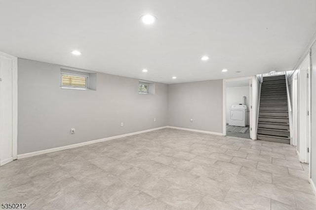 below grade area with washer / clothes dryer, baseboards, recessed lighting, and stairway