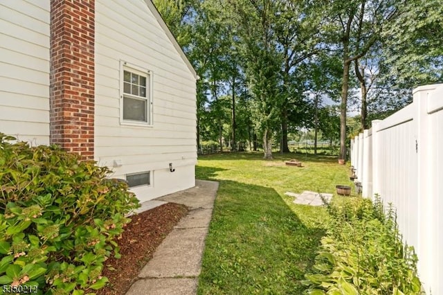 view of yard with a fenced backyard