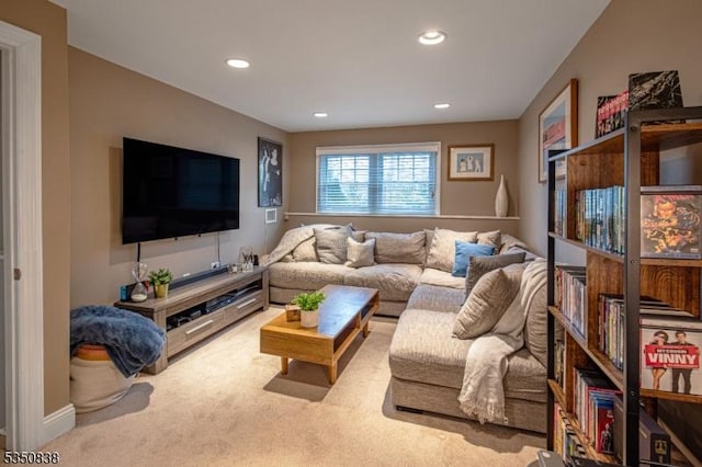 living area featuring carpet flooring and recessed lighting