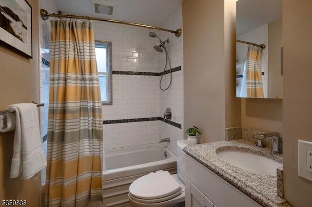 bathroom with shower / bath combo with shower curtain, toilet, visible vents, and vanity