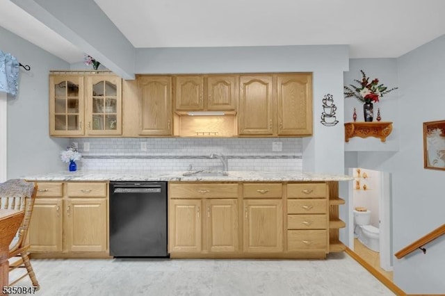 kitchen with dishwasher, light brown cabinetry, a sink, light stone countertops, and backsplash