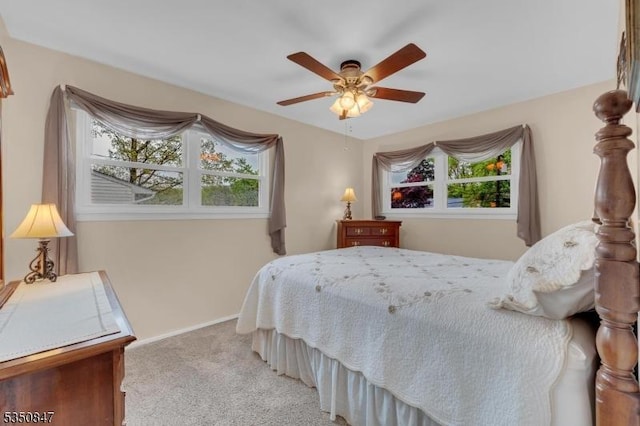 bedroom with carpet, baseboards, and a ceiling fan