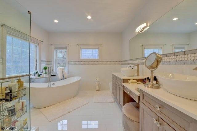 1 Dock Watch Hollow Rd, Warren Twp, NJ 07059 - full bathroom with plenty of natural light, two vanities, tile walls, a soaking tub, and tile patterned flooring