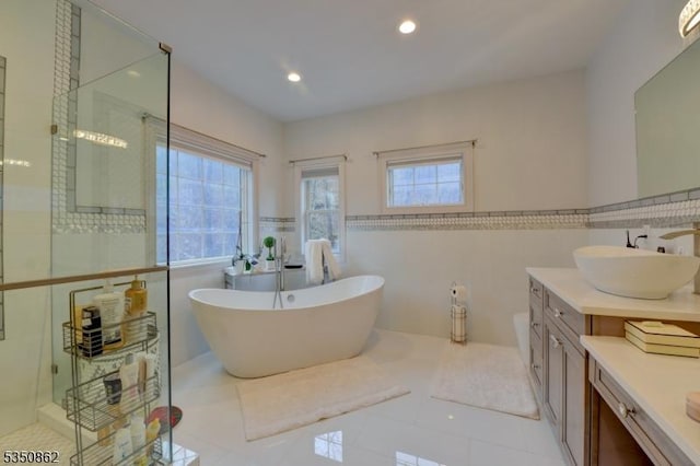 1 Dock Watch Hollow Rd, Warren Twp, NJ 07059 - bathroom featuring tile walls, a shower stall, a soaking tub, vanity, and wainscoting