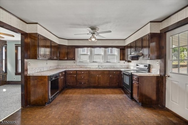 kitchen with electric range oven, under cabinet range hood, ceiling fan, light countertops, and black dishwasher