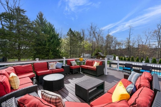 wooden terrace with an outdoor hangout area