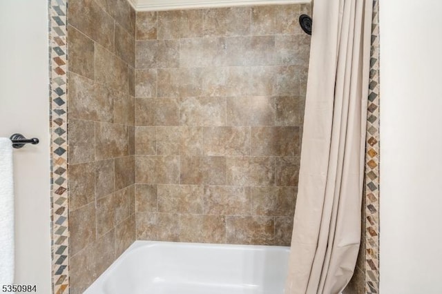 bathroom with shower / tub combo with curtain