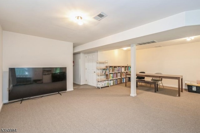 finished basement featuring carpet flooring and baseboards
