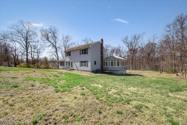 187 Mount Horeb Rd, Warren Twp, NJ 07059 - rear view of property with a sunroom, a lawn, and a chimney