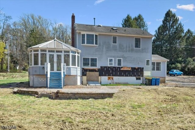 187 Mount Horeb Rd, Warren Twp, NJ 07059 - rear view of house with a chimney, a sunroom, and a yard