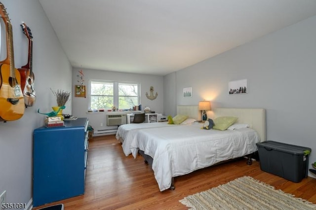 807 Eves Dr Unit 3P, Hillsborough Twp, NJ 08844 - bedroom with wood finished floors and a baseboard heating unit