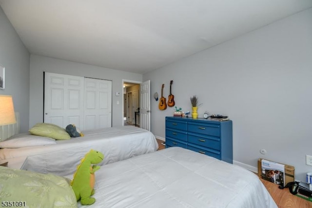 807 Eves Dr Unit 3P, Hillsborough Twp, NJ 08844 - bedroom featuring a closet, wood finished floors, and baseboards