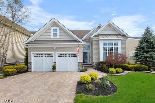 craftsman inspired home featuring metal roof, stone siding, and a standing seam roof