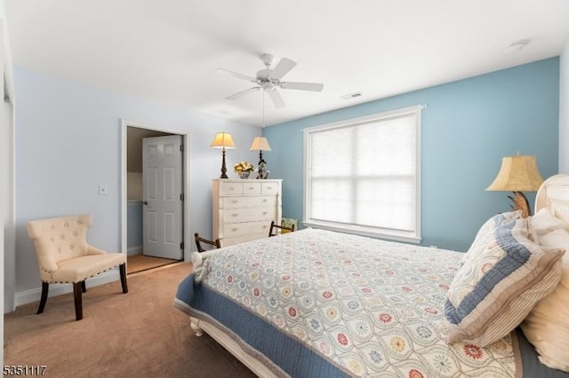 bedroom featuring carpet floors, baseboards, ceiling fan, and visible vents