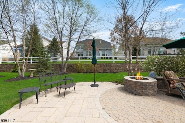 view of patio with an outdoor fire pit