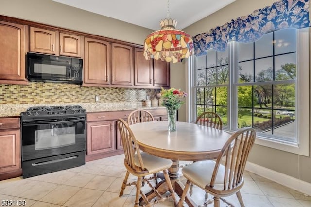 kitchen with black appliances, plenty of natural light, backsplash, and light tile patterned flooring