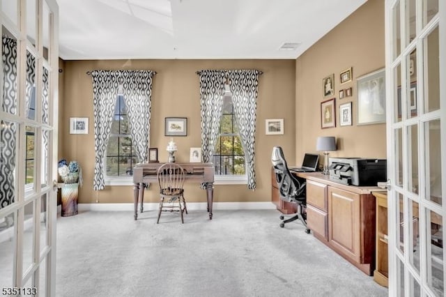 office featuring french doors, baseboards, and light colored carpet