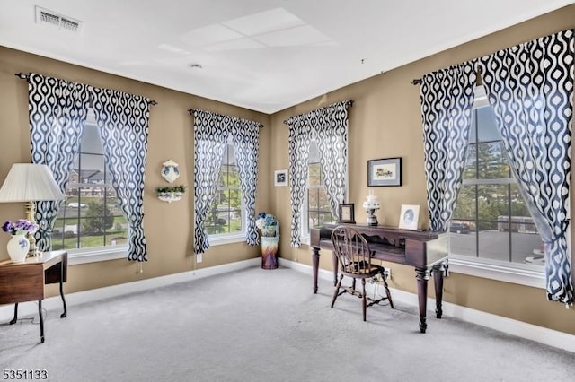 carpeted office space with baseboards