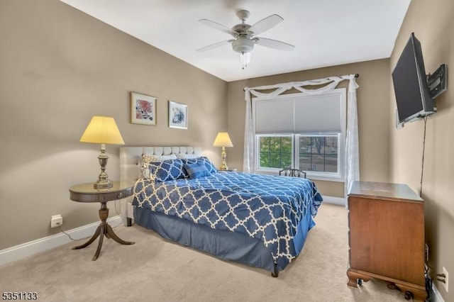 bedroom with carpet floors, baseboards, and a ceiling fan