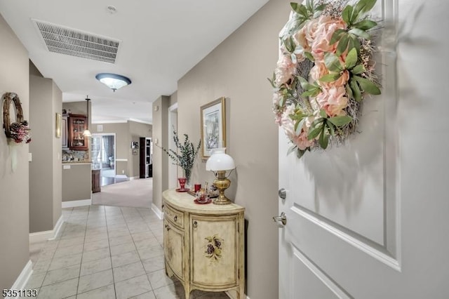 hall featuring baseboards