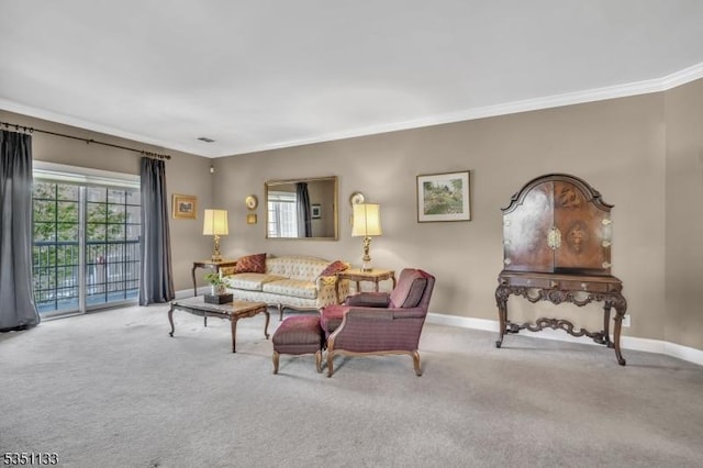 living room with crown molding, baseboards, and carpet flooring
