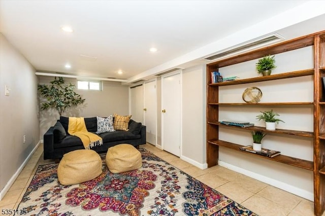 living area with baseboards, recessed lighting, light tile patterned flooring, and visible vents