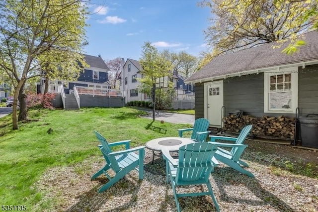 view of yard featuring a residential view and a fire pit
