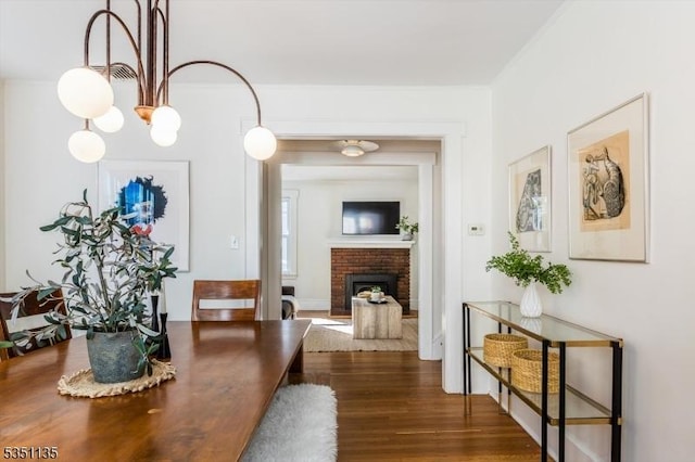 hallway with crown molding and dark wood-style flooring