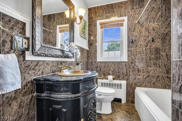 106 Anderson St, Raritan Boro, NJ 08869 - full bathroom featuring radiator heating unit, tile walls, toilet, crown molding, and vanity