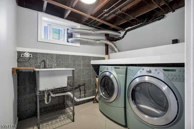 106 Anderson St, Raritan Boro, NJ 08869 - washroom with washer and clothes dryer and tile patterned flooring
