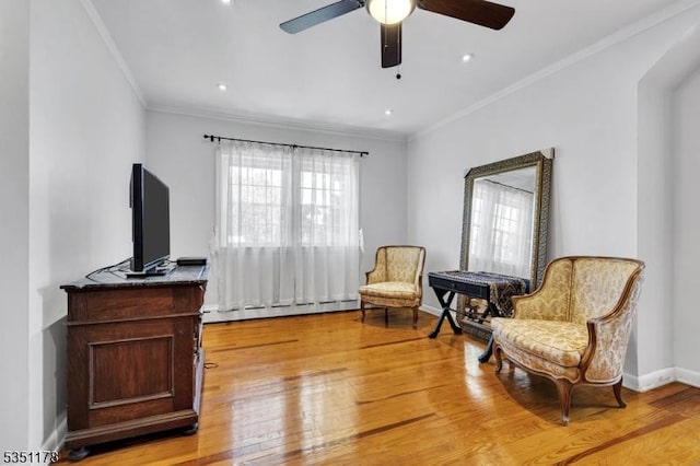 106 Anderson St, Raritan Boro, NJ 08869 - living area featuring a baseboard radiator, light wood-type flooring, a ceiling fan, crown molding, and baseboards