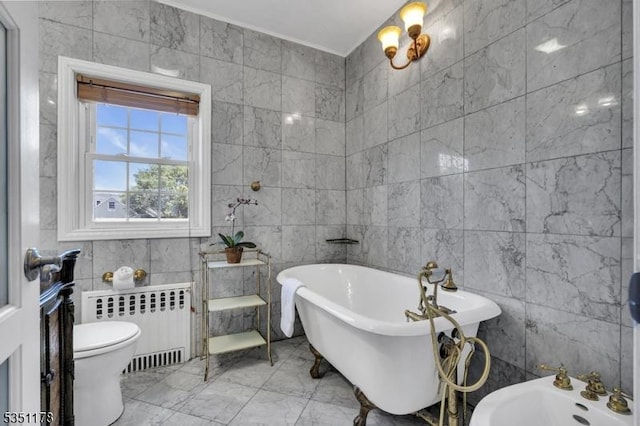 106 Anderson St, Raritan Boro, NJ 08869 - full bathroom featuring radiator, tile walls, a soaking tub, marble finish flooring, and a bidet