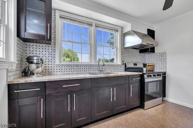 106 Anderson St, Raritan Boro, NJ 08869 - kitchen with stainless steel electric range, wall chimney exhaust hood, a sink, baseboards, and decorative backsplash