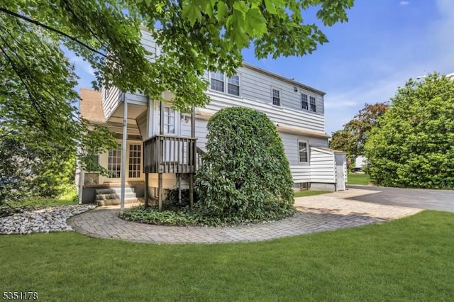 106 Anderson St, Raritan Boro, NJ 08869 - back of house featuring a lawn