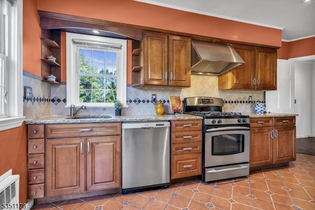 106 Anderson St, Raritan Boro, NJ 08869 - kitchen with appliances with stainless steel finishes, wall chimney exhaust hood, open shelves, a sink, and brown cabinets