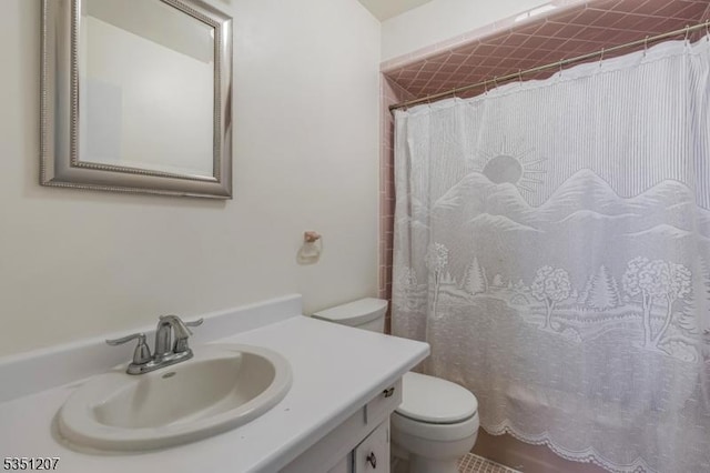 bathroom with toilet and vanity
