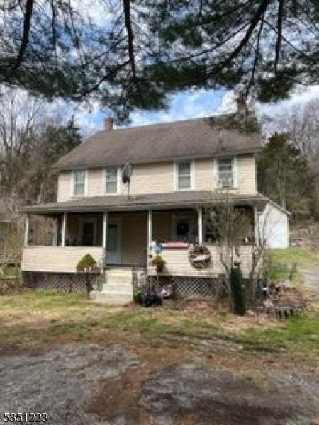 1049 County Road 521, Stillwater Twp, NJ 07860 - view of front of home with covered porch and a chimney